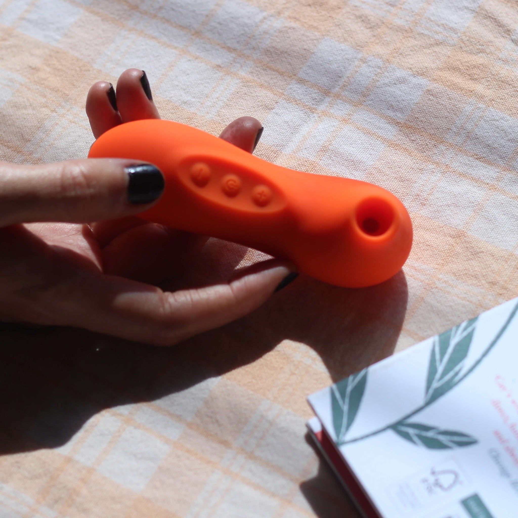 Hand holding suction vibrator