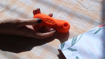 Hand holding suction vibrator