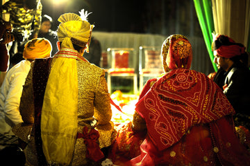 Indian Bride And Groom Sitting Down