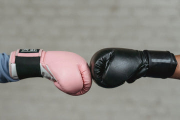 Anonymous fighters bumping fists before boxing