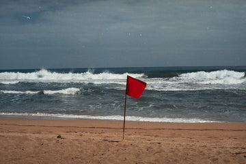 A red flag on the beach