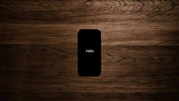 Turned on Black Iphone 7 Displaying Hello