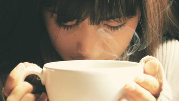 Woman Holding White Cup