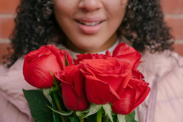 Photo Of Woman Holding Red Roses, One Of The Best Valentine's Gift For Girlfriend