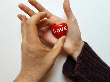  A couple holding a red heart