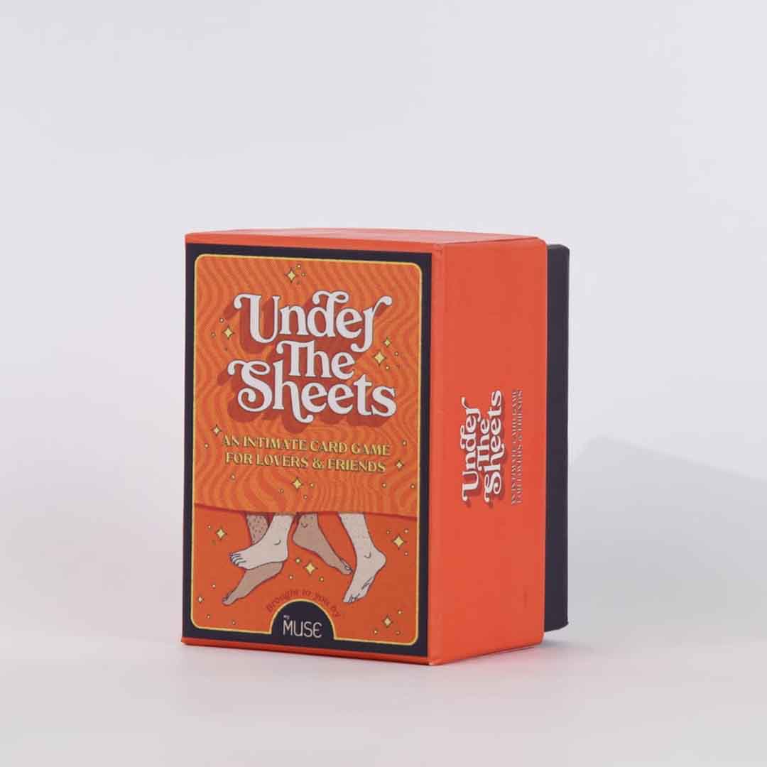 Front view of a box of under the sheets intimate naughty card game for couples