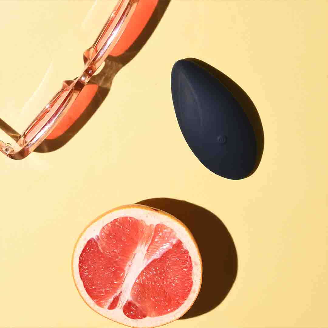 Palm Massager is laying on top of a journal 