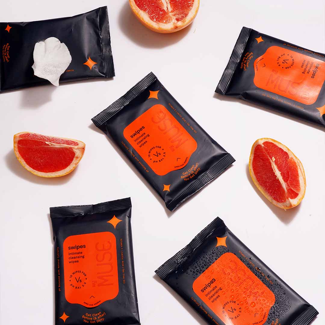 MyMuse's Swipes: top view of five packs of Swipes and slices of blood oranges