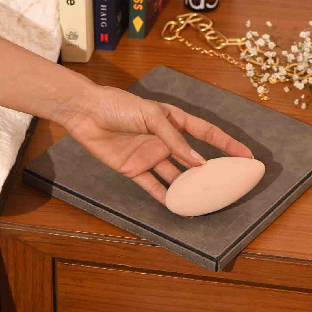 Hand holding Brushed Suede Palm Massager